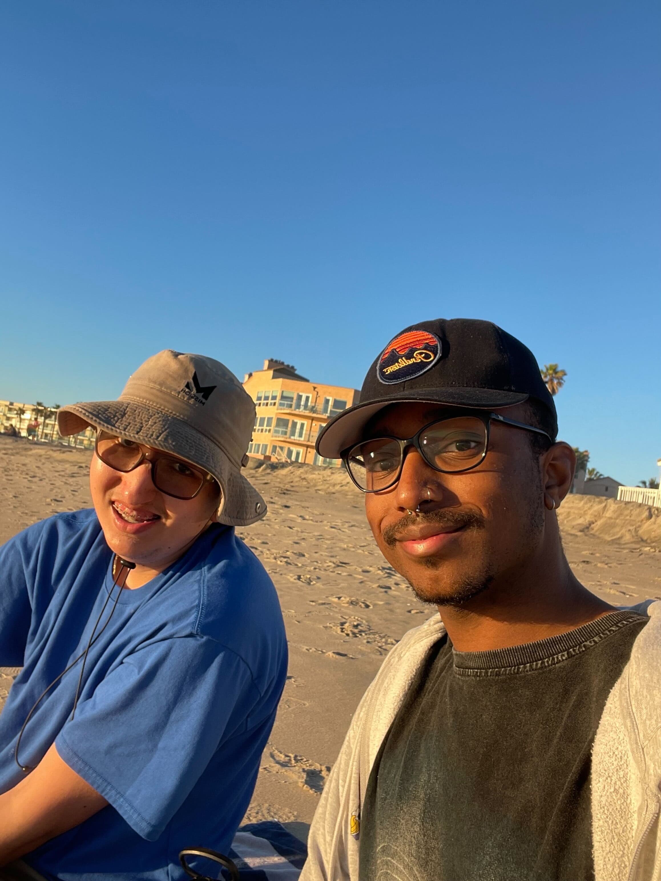 Two Homies roommates smiling together at the beach